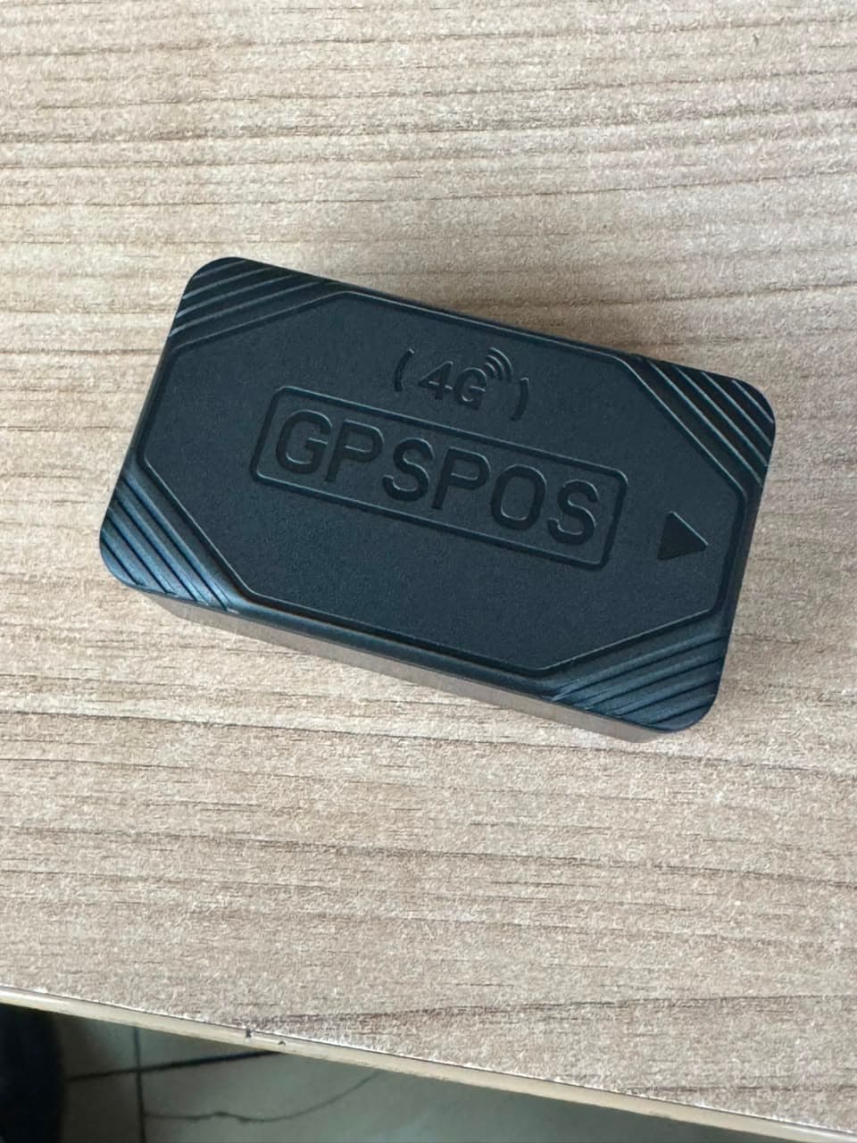 GPSPOS 4G GPS tracker unit viewed from above before installation